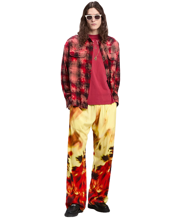 Person wearing a red and black plaid shirt.